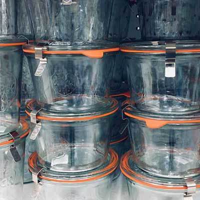 Image of stacks of clear glass canning jars